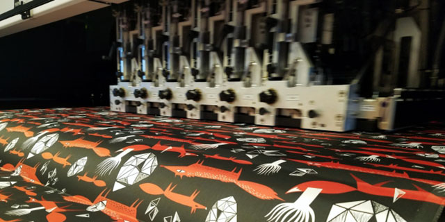 Natural fabric being printed with reactive inks