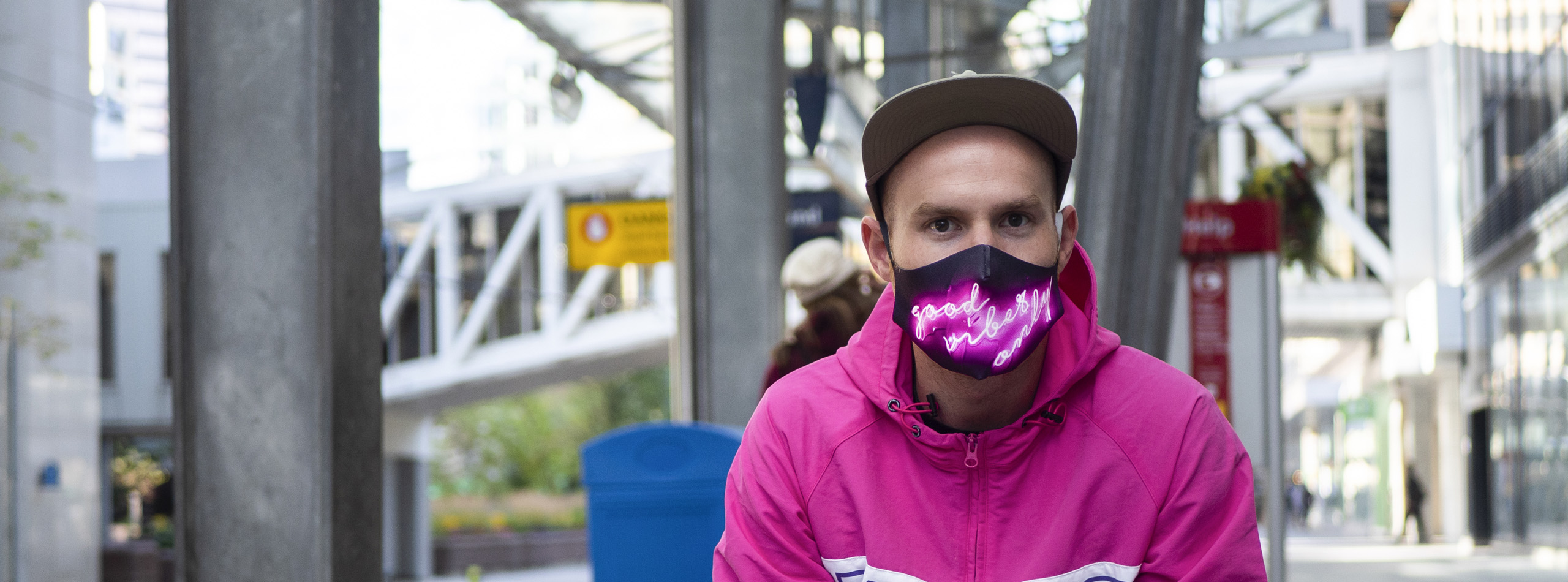 Man in city with custom printed face covering