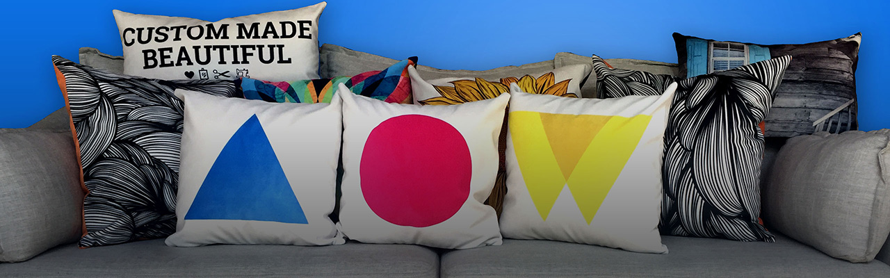 Picture of custom printed pillows on a couch