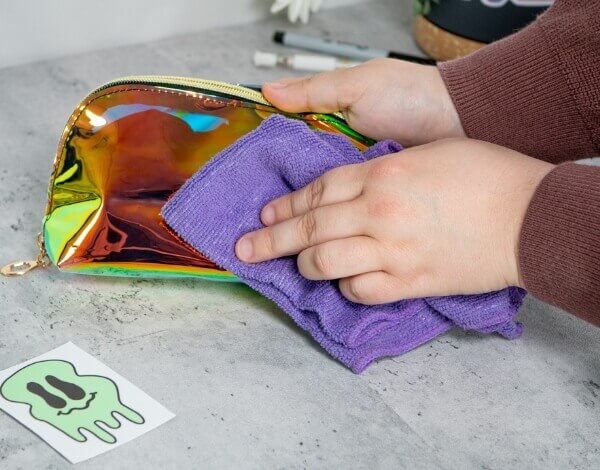 Person cleaning a pencil case